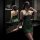 Elegant green snake-style lace cheongsam sleep dress with sheer mesh halter neck design, bodycon fit for women.