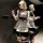 Blonde woman in black and white soft anime lolita maid outfit by qing rumai, holding a spoon and teacup.