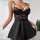 A black lace trim sleep dress featuring adjustable straps and a heart clasp, perfect for evening wear.