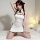 A woman poses on a bed wearing a white spring mountain dream lingerie set, featuring a sexy chinese-inspired robe with ties, ...