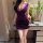 Woman in purple lace bodycon skirt holding wine glass, elegant sleepwear for intimate nights.