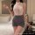 Woman wearing sugar island seductive lingerie set – modest lace bodycon dress with high neck and gray skirt, perfect for slee...
