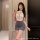 Woman wearing sugar island seductive lingerie set – modest lace bodycon dress with gray mini skirt, alluring secretary style ...