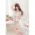 A woman poses elegantly in a sujing sexy plus size one-piece bodysuit, featuring lace and stretch fabric, inspired by europea...