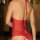 Sexy red lace bodysuit with backless design and lace-up detail, perfect for evening wear or sleepwear.