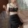 Sultry lace sheer sleepwear set featuring a black lace bralette with crisscross straps and a matching sheer skirt, perfect fo...