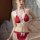 Woman wearing red lace-trimmed lingerie set with white bows, featuring halter top and matching bottoms in sultry sheer mesh s...