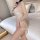 Woman wearing sultry sheer lingerie set for small bust - pure temptation sleepwear, posing on a bed with elegant bedroom ambi...