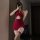 Sultry sheer qipao lingerie set featuring a vibrant red dress with cutouts, lace detailing, and stockings, perfect for a sens...