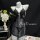 Black lace bodysuit with sheer mesh, low-cut bust and cut-outs on mannequin. summer sexy lace bodysuit by peritreasure.