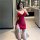 A woman poses in a bathroom, wearing a red summer thin low-cut v-neck sexy nightgown set. the backless bodycon sleep dress fe...