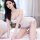 Woman wearing suoqing purple floral lace chemise - sexy sheer sleepwear with no-remove design, perfect for small bust.