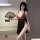 Woman in suoqing seductive deep v lingerie set with floral rose details and high-slit strap dress, holding a lace fan.
