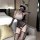 Woman wearing suoqing sexy bunny lingerie set with sheer lace bodysuit, polka-dot gloves, and thigh-high stockings in a hotel...
