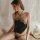 Woman wearing black suoqing lace bodysuit with adjustable straps, elegant lingerie set for plus size, sensual sleepwear desig...