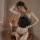 Woman wearing black lace bodysuit with adjustable straps, elegant lingerie set for plus size, sensual sleepwear by suoqing.
