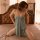 Woman wearing suoqing sexy lace chemise nightgown with adjustable straps and high-slit design, sitting on bed in sensual plus...