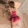 Woman in red satin suoqing sleep dress with lace trim, back crisscross straps, and side slit — sensual plus size nightwear on...