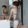 Woman wearing suoqing sexy lingerie jeans shorts, a no-remove passion outfit for bedroom play and roleplay, posing in front o...