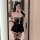 Woman wearing suoqing sexy lingerie skirt with cat ears, lace bodice, and ruffled mini dress in mirror selfie.