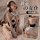 Woman modeling suqing sexy lace maid costume set with neck strap, apron & ruffled trim — seductive sleepwear outfit shown fro...