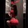 A woman poses in a red sweet fa fa sexy lingerie set, featuring an ultra-short bodycon skirt and a pure temptation tight tee,...