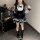 A stylish woman wears a sweet lace doll collar bow dress featuring an american preppy style. the dress has a spring/fall a-li...