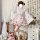 A woman poses in a sweet lolita maid dress set, featuring a floral-patterned kimono with ruffles and a matching apron. the ou...