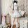 A woman models a sweet lolita maid dress set featuring a floral kimono, apron, and ruffled skirt, perfect for cosplay with bo...