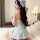 A woman wearing a sweet maid costume set, featuring a light blue dress with lace details and a bow headband, perfect for role...