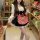 A woman models a sweet maid outfit featuring a plaid apron dress with a bow and waist cinching petticoat, perfect for spring ...
