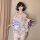 A woman poses elegantly in a sweet & seductive yukata robe featuring floral prints, satin trim, and a bow detail, perfect for...