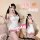 A woman wearing a white bodysuit with pink cat ears, designed as a cute kawaii cat-themed lingerie set. the outfit features r...