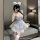 Woman wearing tangdao pure & tempting lingerie set — sheer maid-inspired sleepwear with lace trim, garters, and fluffy ears.