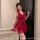 Woman wearing pink lace cami nightgown with bow detail and sheer polka-dot overlay, elegant sensual sleepwear.
