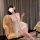 Woman wearing tangdao sensual sleepwear, a modest yet sexy lace cami nightgown with sheer overlay and bow detail.
