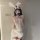 Woman wearing taoxitang sexy lingerie set with sheer lace sleep dress, bunny ears headband, and matching costume outfit.