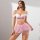 A woman models a temu lingerie set featuring a white lace bra with off-the-shoulder design and a pink floral mesh mini skirt,...
