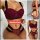 Woman modeling a three-piece lace sheer matching set with a push-up bodysuit and thong lingerie in burgundy and black.