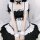 A woman wearing a black and white maid cosplay dress with ruffles and bows, perfect for lolita fashion or student uniforms.