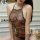 Woman wearing transparent embroidered lingerie set with floral patterns, inspired by ancient chinese hanfu style.