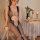 Transparent sensual lingerie set featuring an open-crotch mesh bodysuit and sheer stockings, perfect for women seeking elegan...