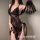 Woman modeling a black lace transparent lingerie set with floral details, including a sheer dress and matching fan accessory.
