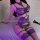 Woman wearing purple lace bodysuit with straps, part of the transparent sexy lingerie set - european style erotic outfit.