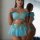 Trendy sheer off-shoulder lingerie set in blue with gold sparkle detail and ruffled trim.