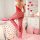 Valentines heart rhinestone bodysuit - sheer mesh open-crotch lace-up corset top & fishnet stockings set, showcased on a bed ...
