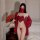 Woman in red vintage chinese costume lingerie set with sheer mask, heart-shaped tassel bodice, and role play outfit holding f...