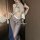 Woman wearing vintage chinese-inspired lace see-through cheongsam lingerie set, featuring sheer fabric and modern hanfu desig...