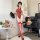 Woman modeling red vintage lace bodysuit set with sheer retro qipao-inspired design, holding fan, wearing thigh-highs.