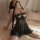 Woman wearing wangchunshan sheer mesh sleep dress with lace trim and adjustable straps, sensual lingerie set on bed.
